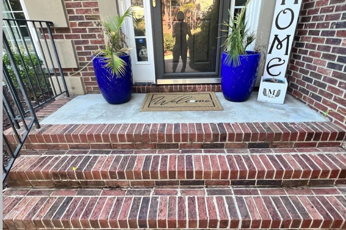 Clean brick porch and steps after professional pressure washing