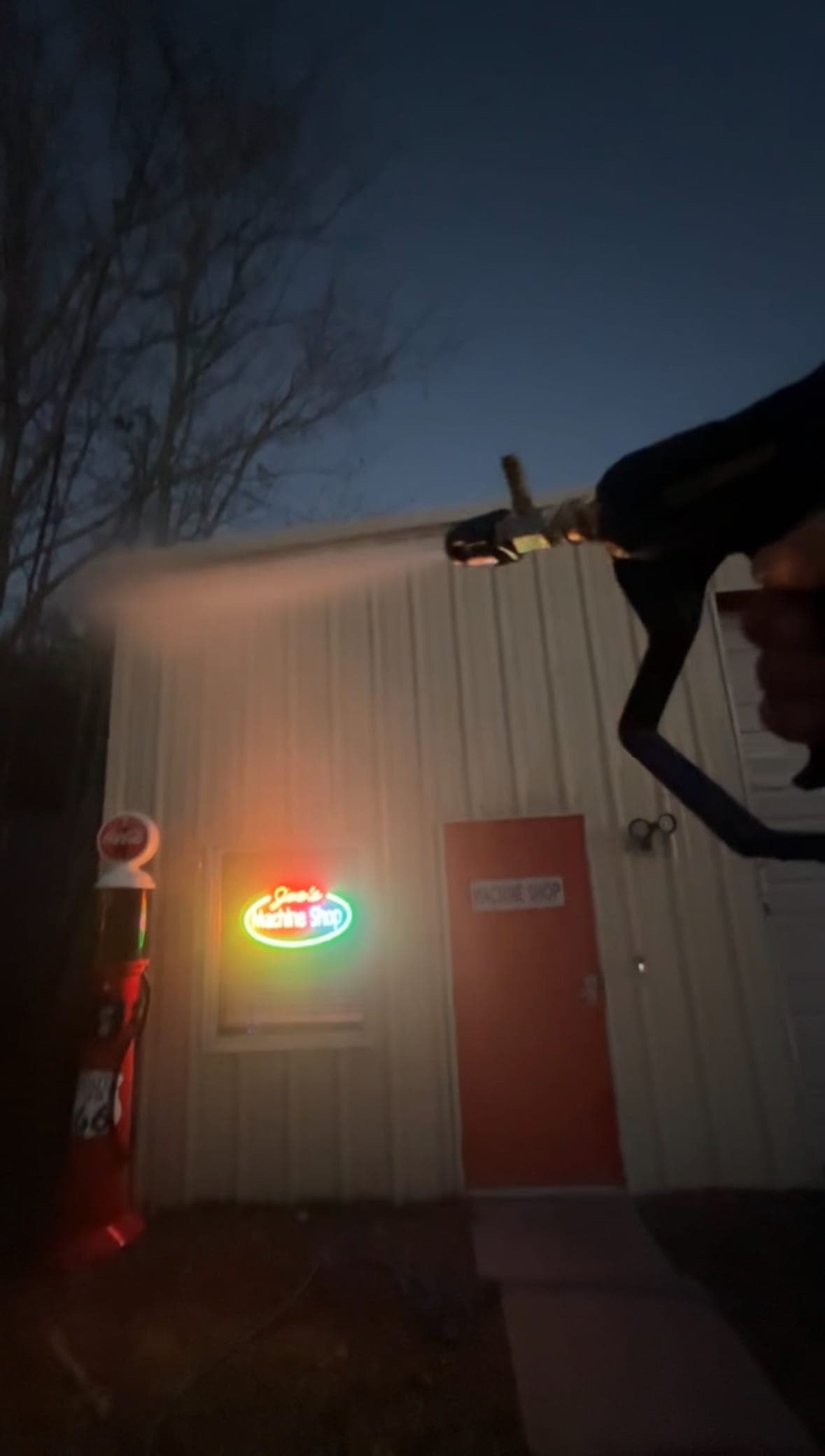 Commercial building pressure washing at night